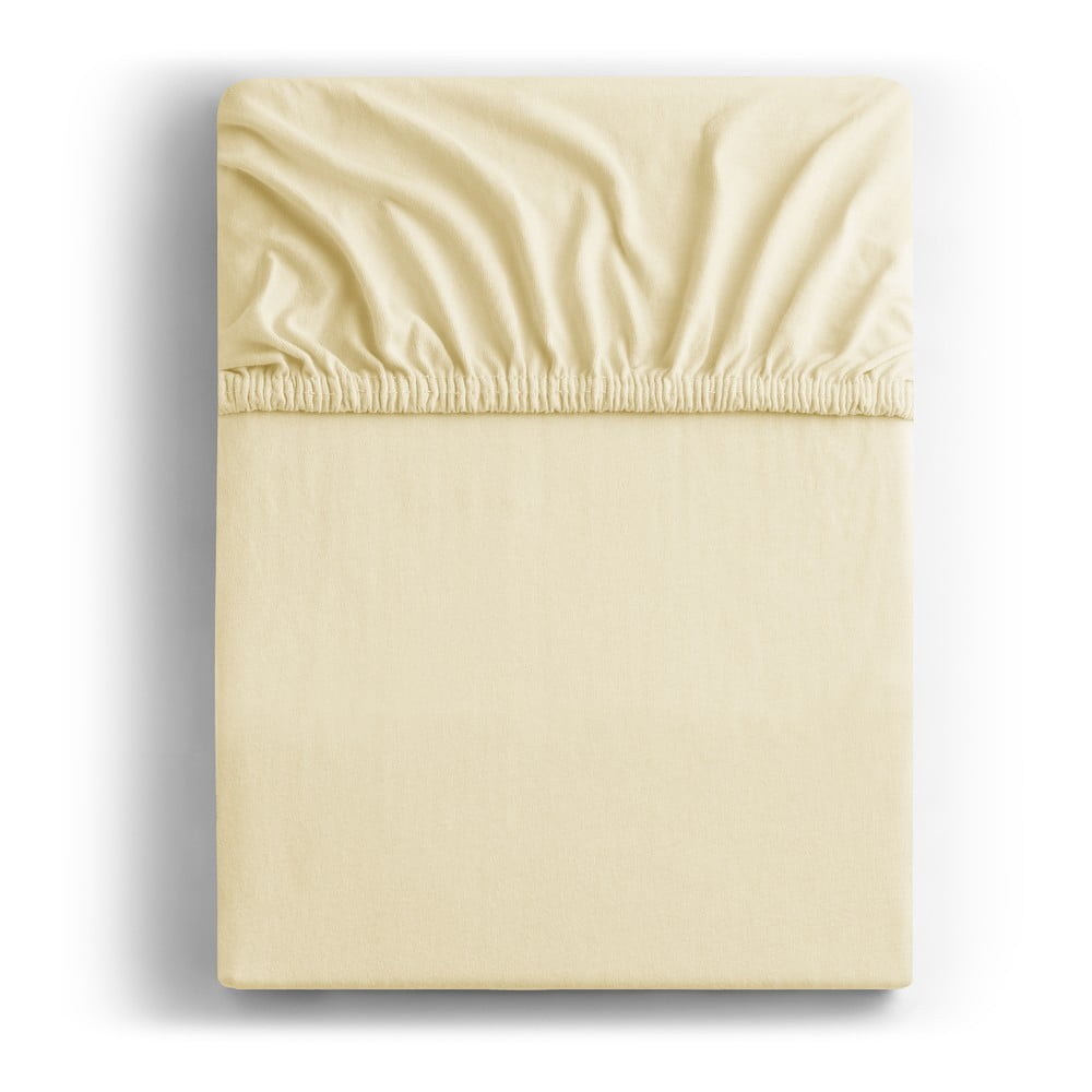 Krémszínű gumis jersey lepedő 120x200 cm Amber – DecoKing